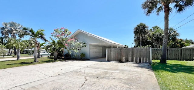 view of side of property with a lawn