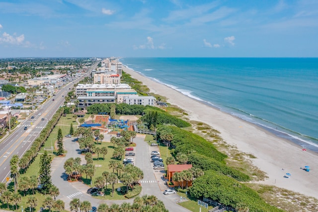 birds eye view of property featuring a view of the beach and a water view