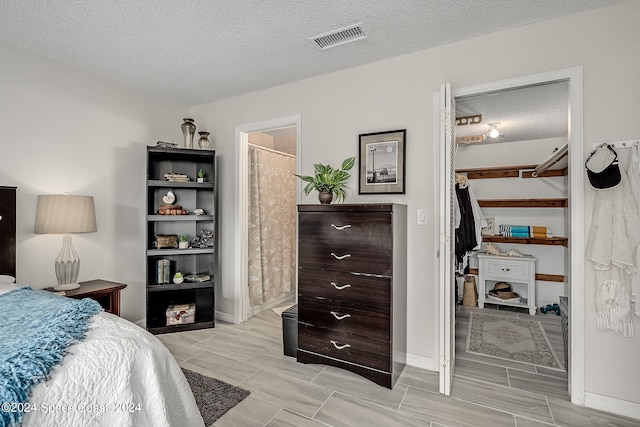 bedroom featuring a textured ceiling