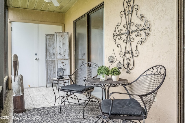 balcony featuring a patio and ceiling fan