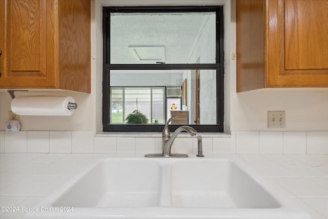 room details featuring sink and tile counters