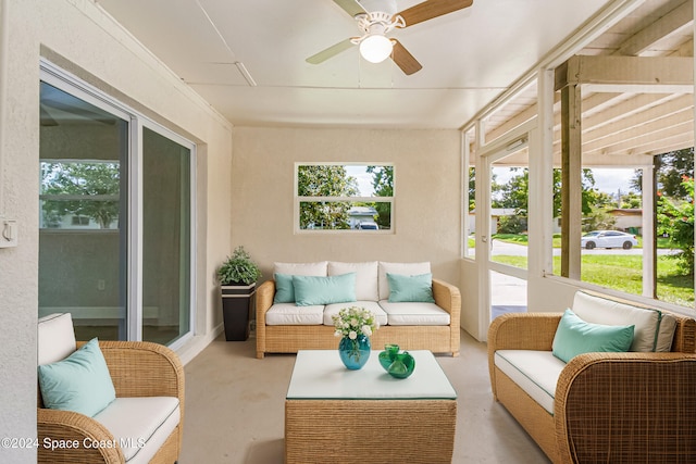 sunroom featuring ceiling fan