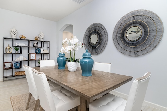 dining area with light wood-type flooring