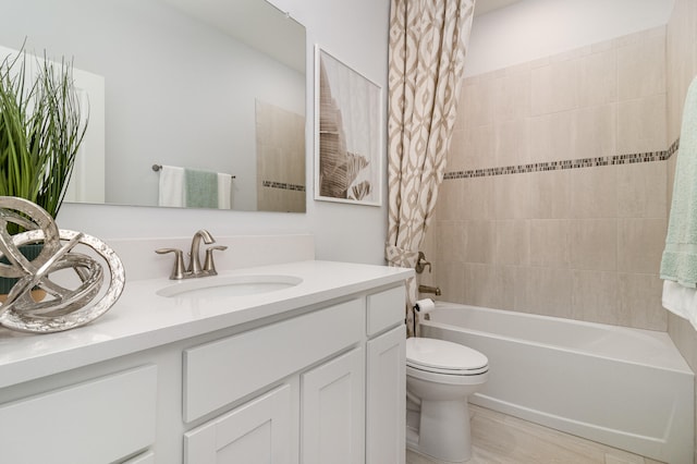 full bathroom with vanity, shower / bathtub combination with curtain, and toilet