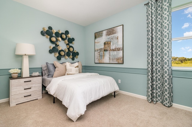 bedroom featuring light colored carpet