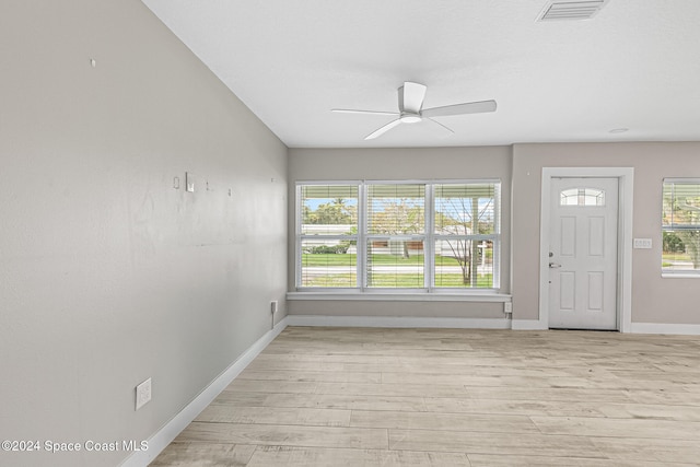 entryway with light hardwood / wood-style floors and ceiling fan