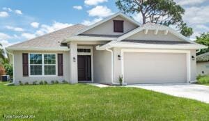 view of front of house featuring a garage and a front lawn