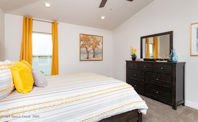 carpeted bedroom featuring ceiling fan and lofted ceiling