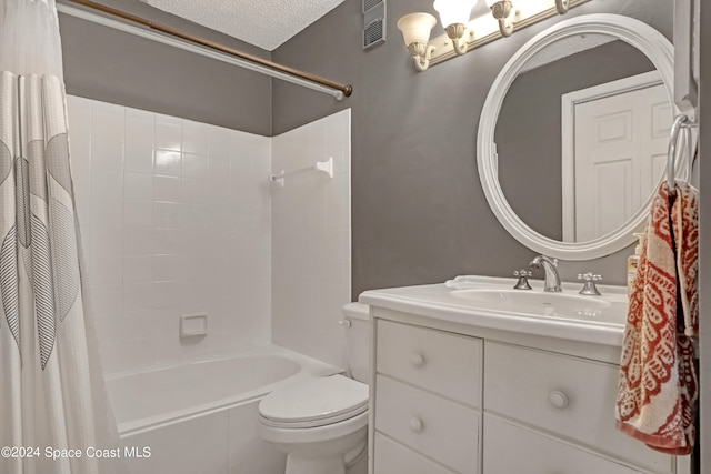 full bathroom with vanity, shower / bath combination with curtain, a textured ceiling, and toilet