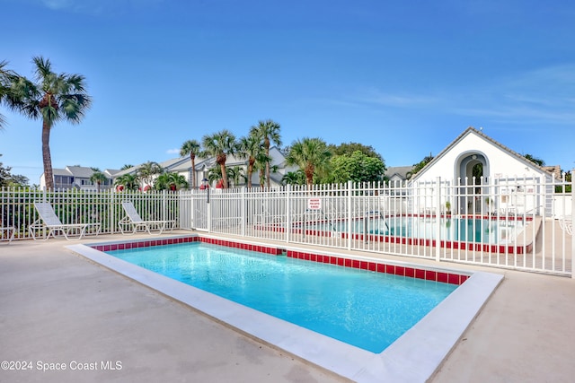 view of pool featuring a patio