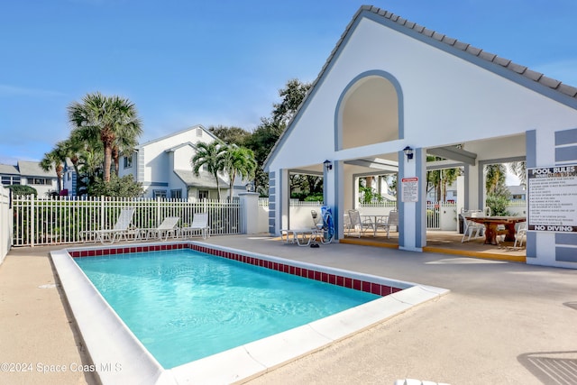 view of swimming pool with a patio area