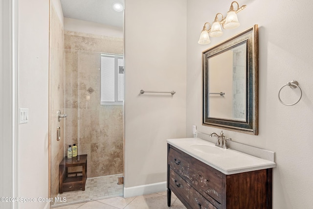 bathroom featuring tile patterned flooring, vanity, and an enclosed shower