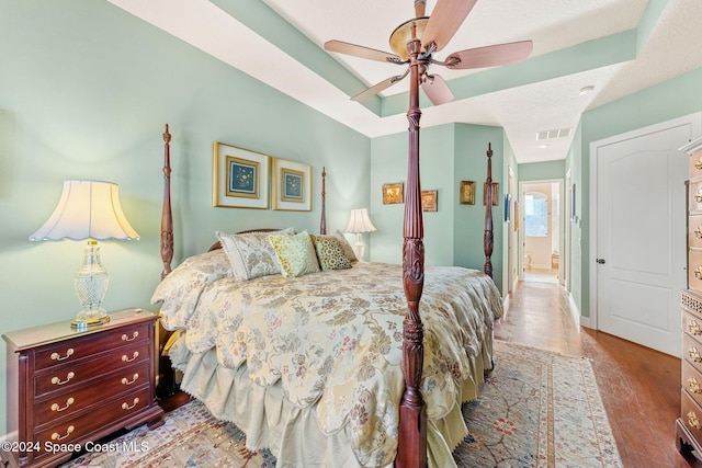 bedroom featuring hardwood / wood-style floors and ceiling fan