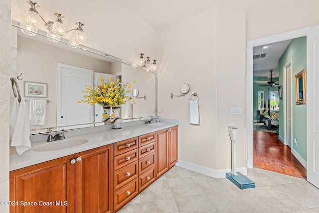 bathroom featuring tile patterned floors, ceiling fan, and vanity