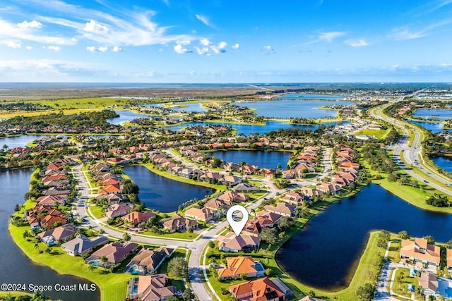 drone / aerial view with a water view