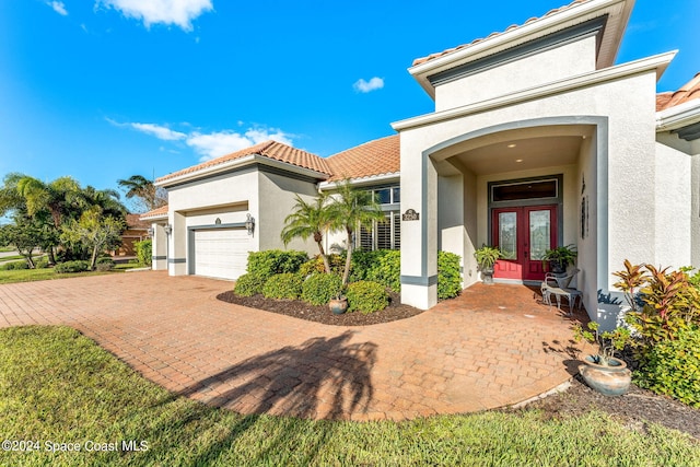 view of front of home featuring french doors and a garage