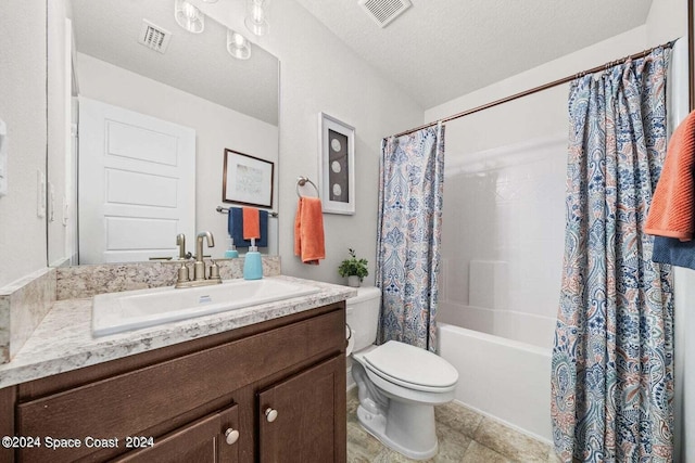 full bathroom with vanity, a textured ceiling, shower / tub combo, tile patterned floors, and toilet