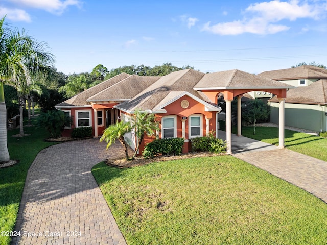 ranch-style house with a front lawn