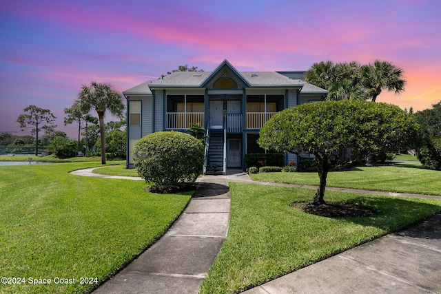 view of front of home with a yard