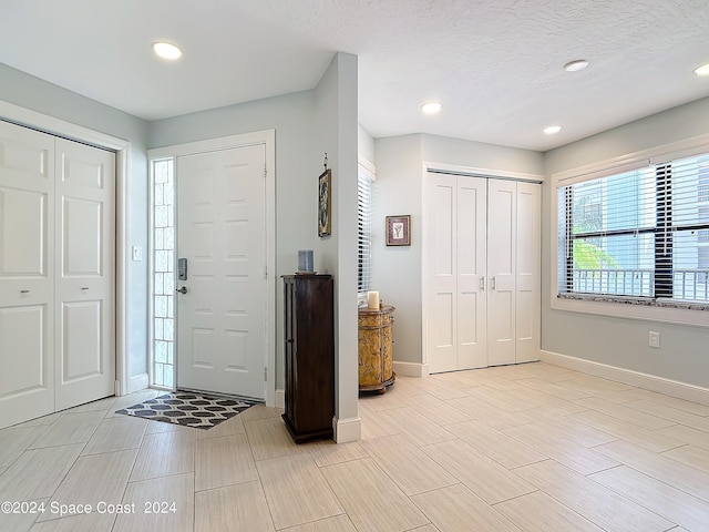 entrance foyer featuring a textured ceiling