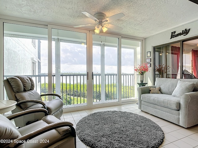 sunroom with a water view and a healthy amount of sunlight