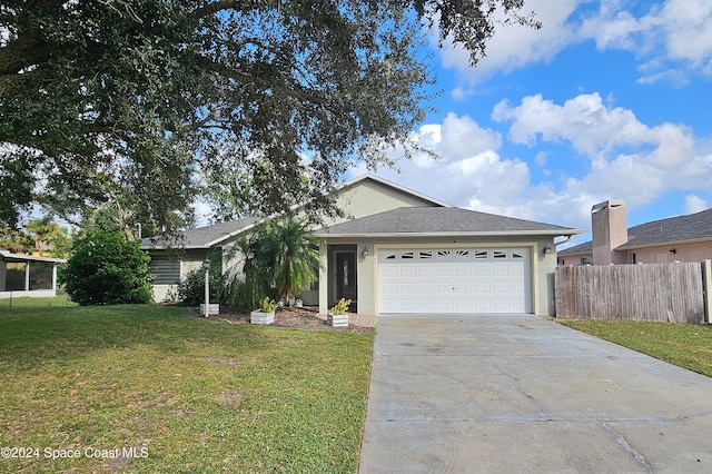 ranch-style home featuring a front yard and a garage