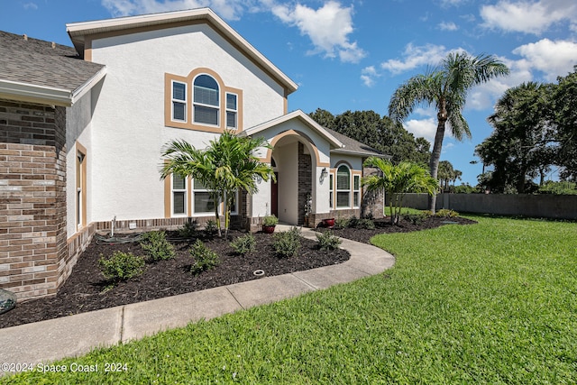 view of front of house with a front lawn