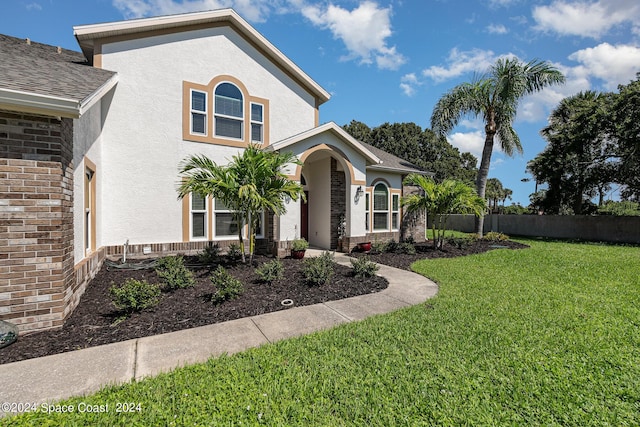 1290 Mercedes Dr, Merritt Island, FL 32952 - view of front of home featuring stucco siding