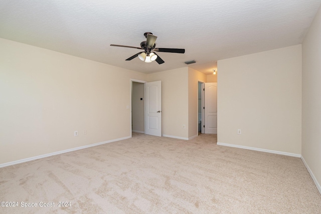 1290 Mercedes Dr, Merritt Island, FL 32952 - unfurnished bedroom featuring light carpet, baseboards, and ceiling fan