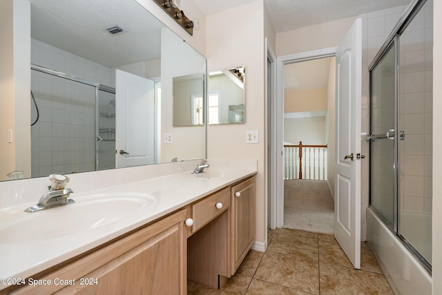 1290 Mercedes Dr, Merritt Island, FL 32952 - full bath with double vanity, combined bath / shower with glass door, and tile patterned floors