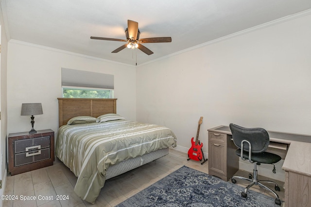 bedroom with light wood-type flooring, ceiling fan, and crown molding