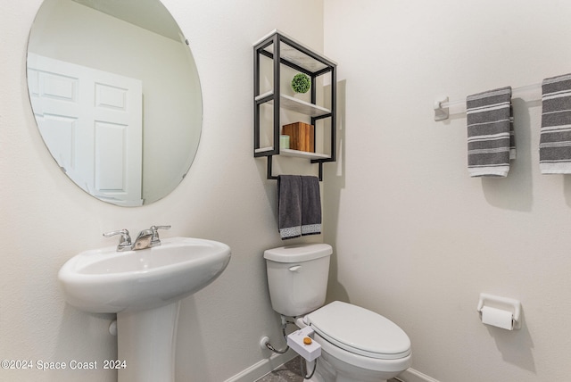 bathroom with toilet and sink