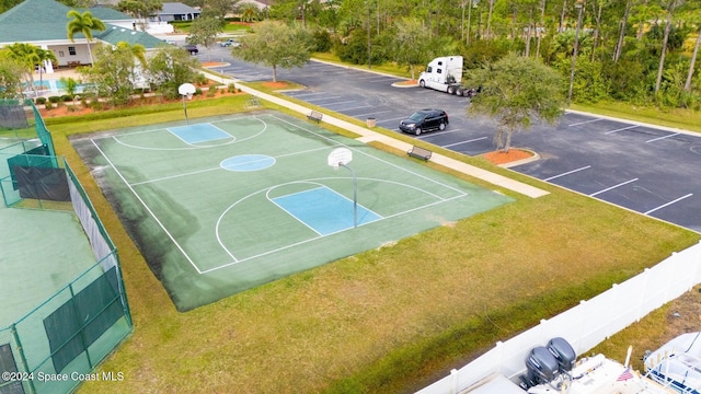 view of basketball court featuring a yard