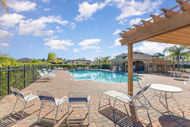 view of pool featuring a patio and a pergola