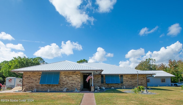 ranch-style house with a front yard