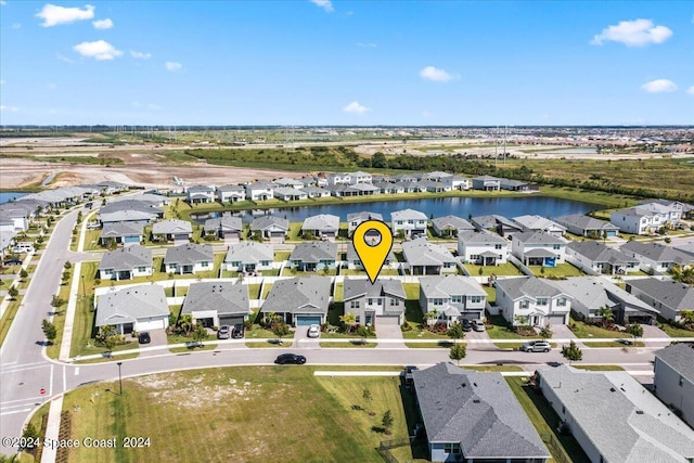 birds eye view of property featuring a water view