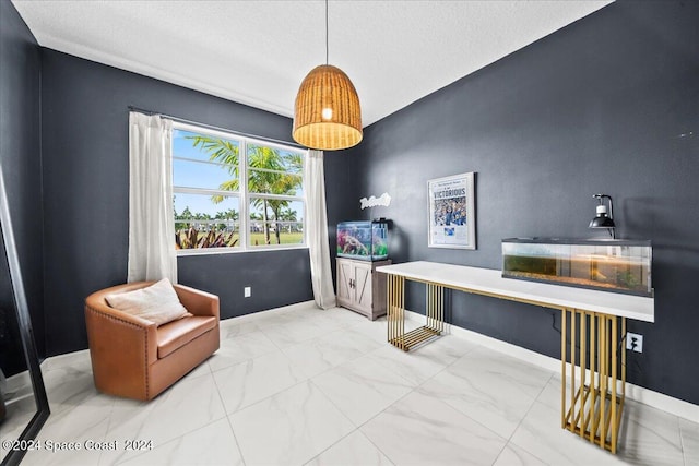 sitting room featuring a textured ceiling