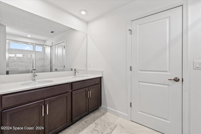 bathroom with walk in shower and vanity