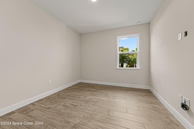 unfurnished room featuring light hardwood / wood-style flooring