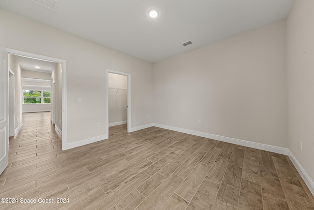 spare room with light wood-type flooring