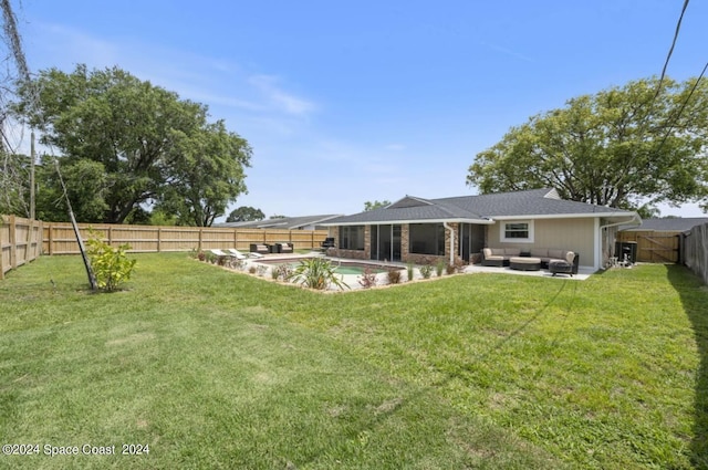 902 Beaverdale Ln, Rockledge, FL 32955 - rear view of house featuring an outdoor hangout area, a fenced in pool, a patio area, a yard, and a fenced backyard
