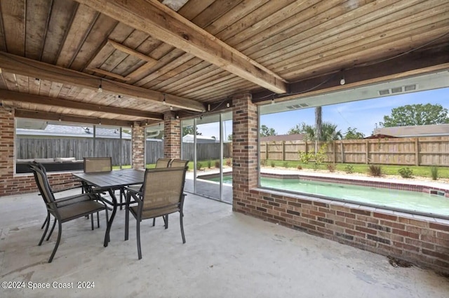 902 Beaverdale Ln, Rockledge, FL 32955 - view of patio / terrace featuring a fenced in pool, outdoor dining area, and a fenced backyard