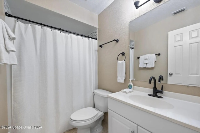 902 Beaverdale Ln, Rockledge, FL 32955 - full bathroom featuring toilet, visible vents, vanity, and a shower with shower curtain