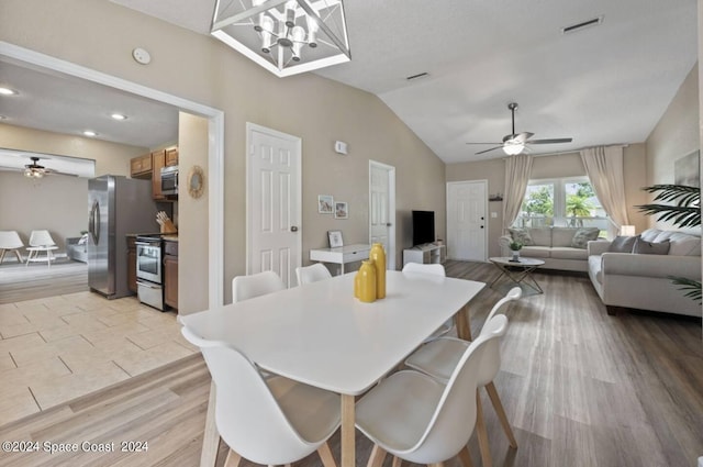 902 Beaverdale Ln, Rockledge, FL 32955 - dining space with light wood finished floors, a ceiling fan, visible vents, and vaulted ceiling