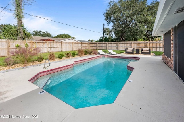 902 Beaverdale Ln, Rockledge, FL 32955 - view of pool featuring a fenced in pool, a patio, and a fenced backyard