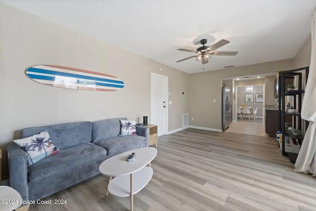 902 Beaverdale Ln, Rockledge, FL 32955 - living area featuring baseboards, visible vents, wood finished floors, and a ceiling fan