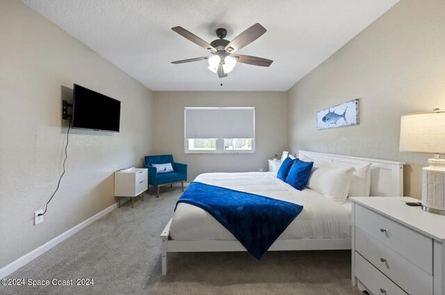 902 Beaverdale Ln, Rockledge, FL 32955 - carpeted bedroom featuring baseboards and a ceiling fan