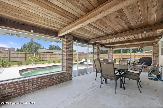 902 Beaverdale Ln, Rockledge, FL 32955 - view of patio / terrace featuring outdoor dining space, a fenced in pool, and a fenced backyard