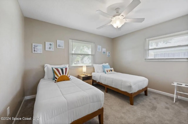 902 Beaverdale Ln, Rockledge, FL 32955 - bedroom featuring carpet flooring, ceiling fan, and baseboards