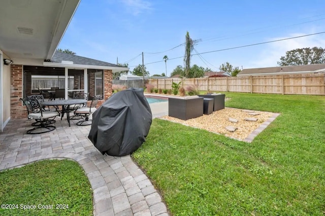 902 Beaverdale Ln, Rockledge, FL 32955 - view of yard with outdoor dining space, a fenced in pool, a fenced backyard, and a patio area